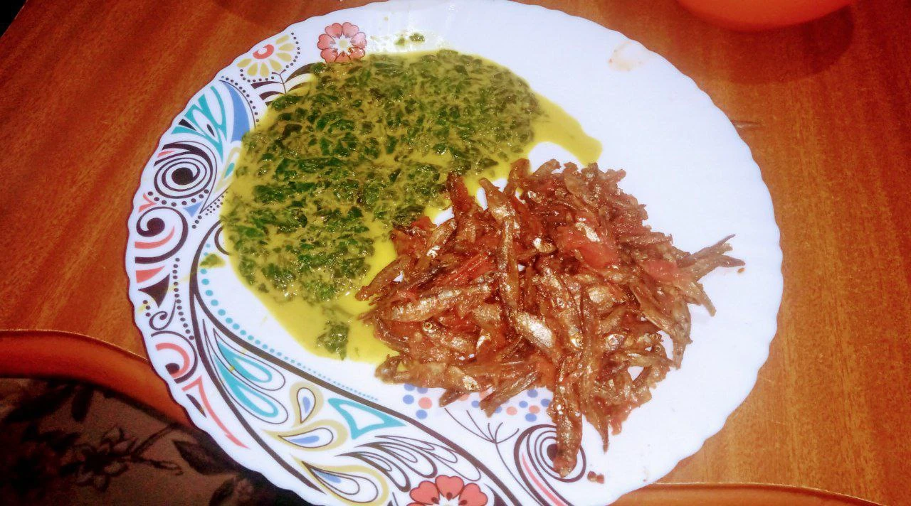 Kenyan leafy vegetables served with small fish